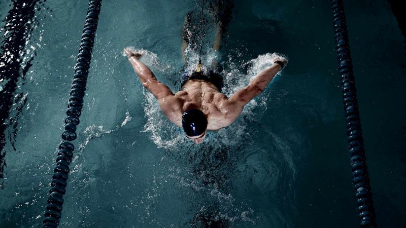 An athlete swimming in the pool.