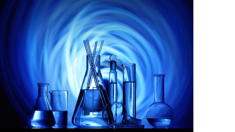 Laboratory tubes with blue background.